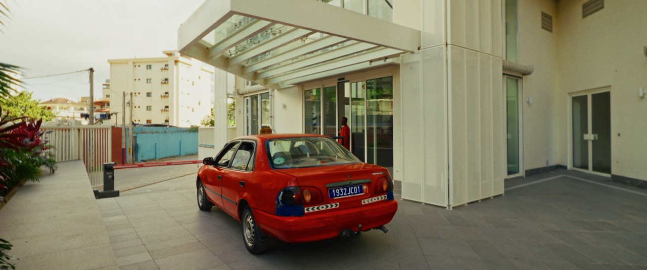 A red car outside ONOMO Allure from Alexon Media’s launch campaign